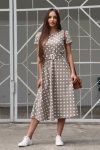 Elegancka sukienka damska w ponadczasowe groszki beż.webp