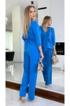 Stylowy komplet z bluzką typu peplum i eleganckimi spodniami chaber.webp